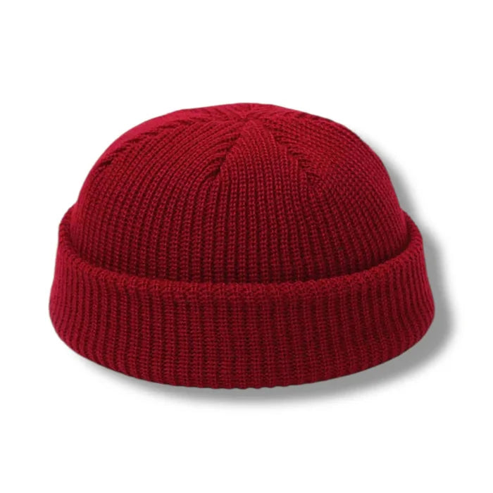 flat lay burgundy red Short Fisherman Beanie Skull Cap solid colors chunky rib knit, rolled cuff, short fit, and unisex skull cap style