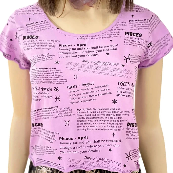 short sleeve graphic pisces baby tee in lilac purple with black zodiac print, fitted crop top with lettuce trim