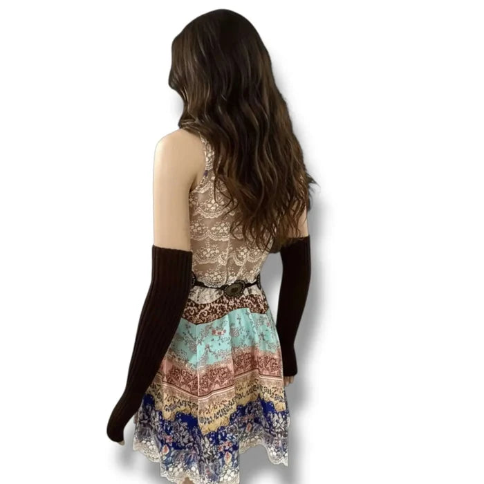 Elegant sleeveless patchwork mini dress with ivory embroidered round neckline, sheer lace back panel, and lace-trim hem in multicolor boho print