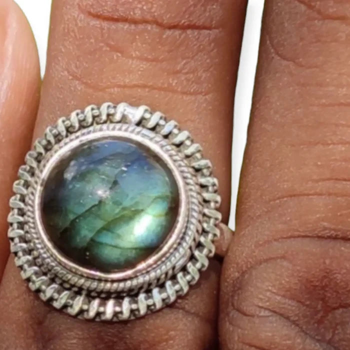 Silver Braided Round Labradorite Ring with bluish green dome cabochon stone and handcrafted sterling silver braided band