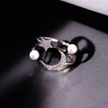Adjustable silver celestial wrap ring with rhinestone moon, star, and faux pearl details – perfect for boho and cosmic-inspired fashion.
