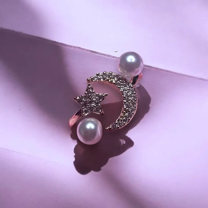 Adjustable silver celestial wrap ring with rhinestone moon, star, and faux pearl details – perfect for boho and cosmic-inspired fashion.