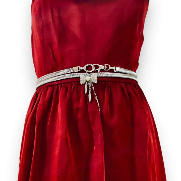 silver crystal bow ring waist belt on model over satin dress