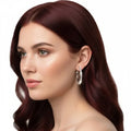 Woman wearing silver crystal medium hoop earrings / 32mm / women's