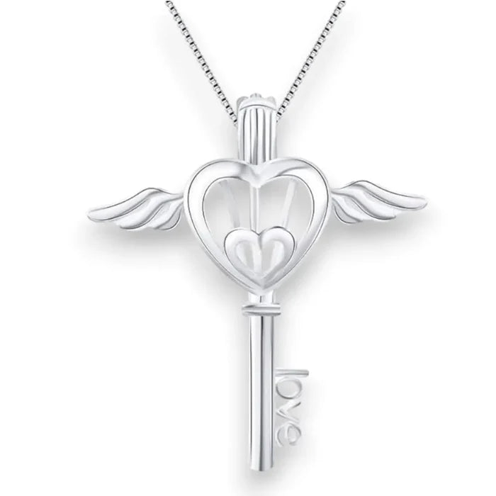 Close-up of silver heart wings key locket necklace with faux pearl and “LOVE” key detail on 16-inch sterling silver chain
