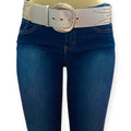 Silver studded oversize buckle wide belt with tribal rivets and wide faux leather strap worn with jeans