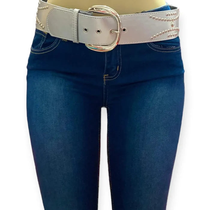 Silver studded oversize buckle wide belt with tribal rivets and wide faux leather strap worn with jeans