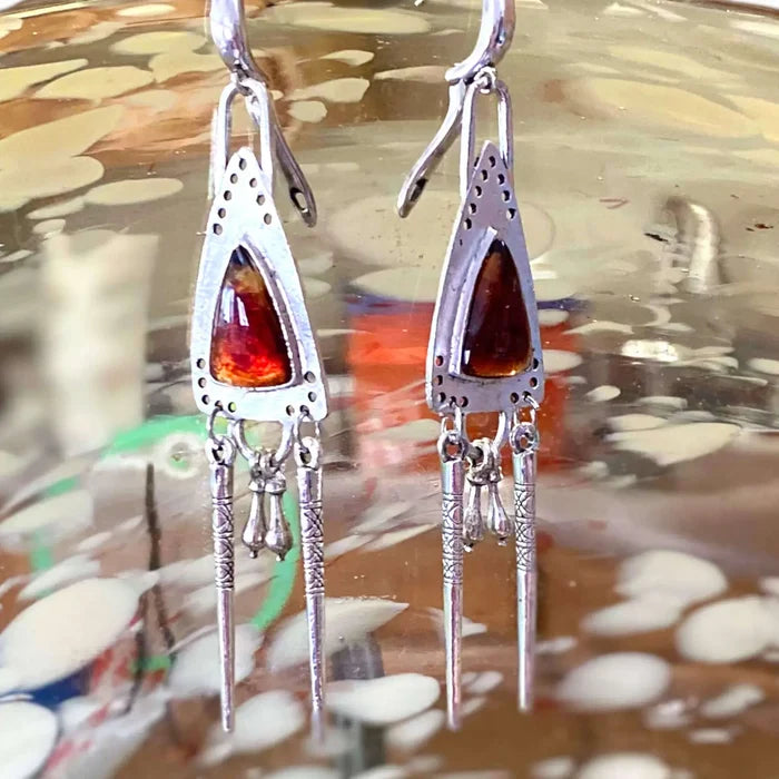 Silver Triangle Chandelier Earrings with orange glass resin center, dangling silver fringe charms, boho western and tribal statement jewelry