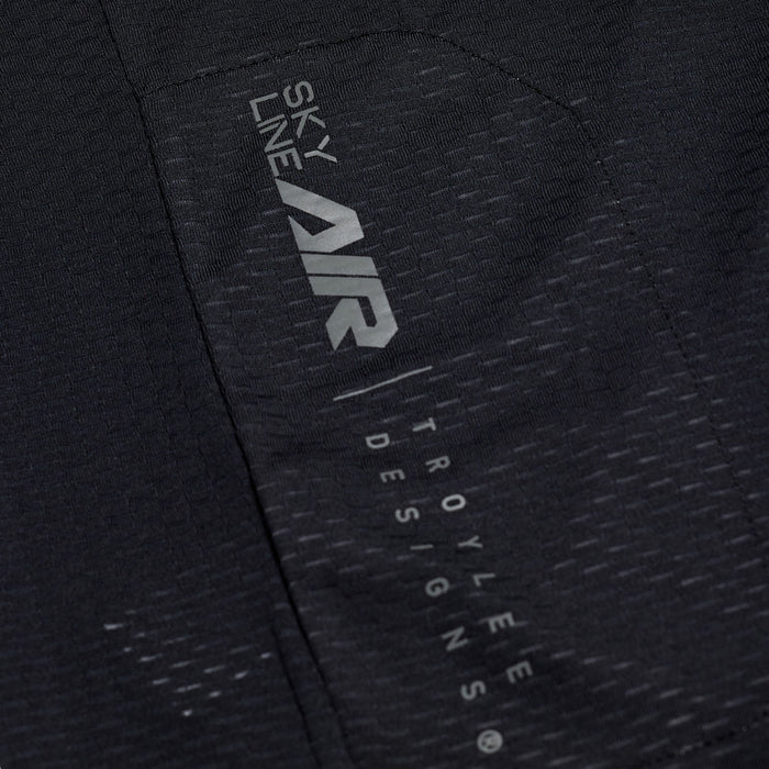 Close-up of a black jacket with 'Sky Line Air' and 'Troy Lee Designs' branding.