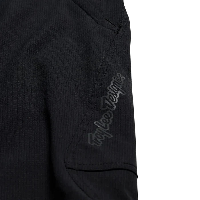 Black jacket with 'Troy Lee Designs' logo on sleeve against a white background