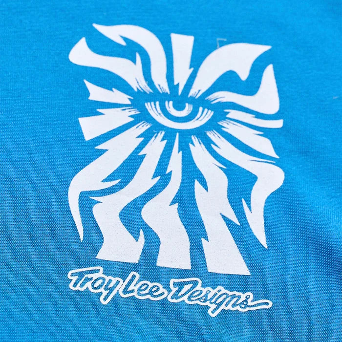 White abstract design on a blue background with 'Troy Lee Designs' text.