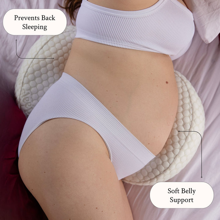 Side sleeper using the Sleepybelly Pregnancy Pillow for soft belly support and to prevent back sleeping