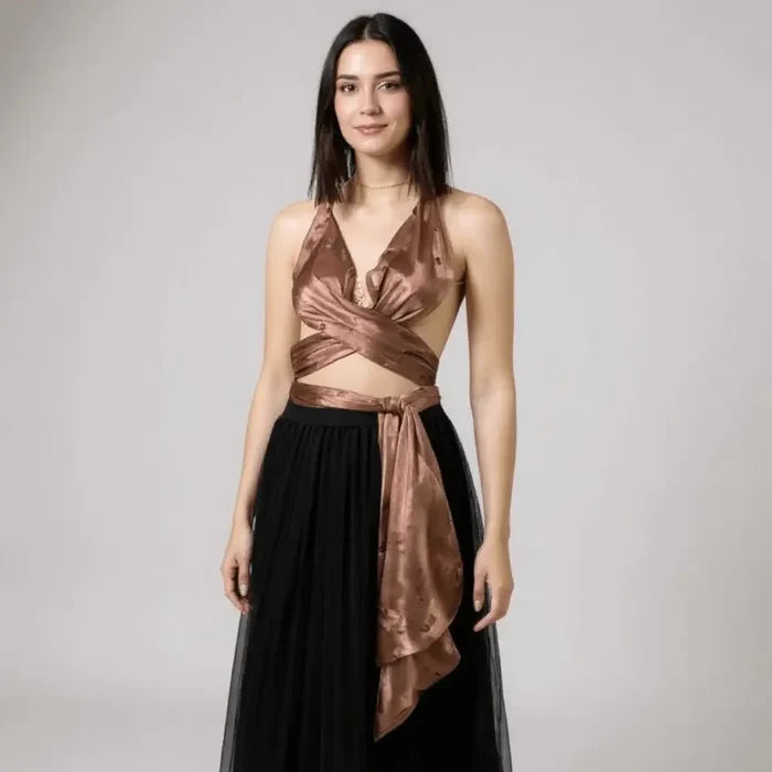 Sleeveless brown multi wrap halter top with plunging neckline, gold chain medallion, backless design, and extra-long ties styled for Y2K streetwear and festival fashion