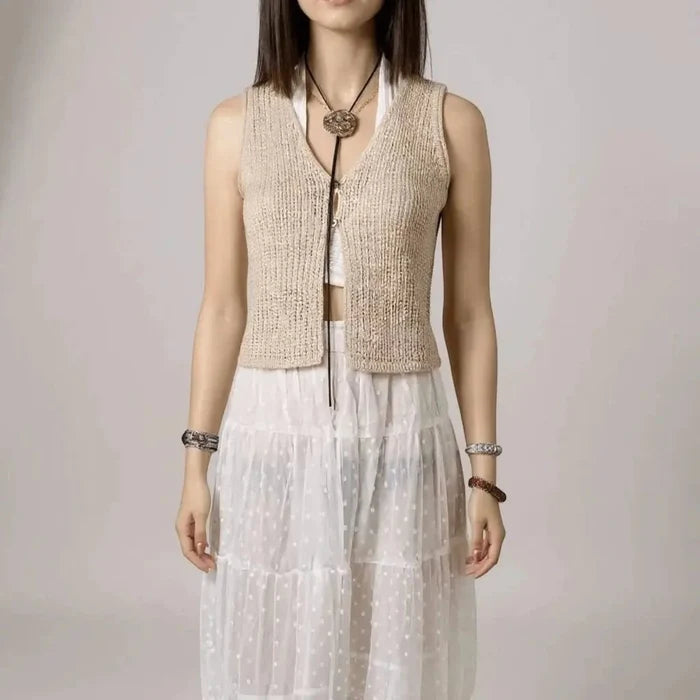 woman wearing with white outfit Tan Sleeveless V Neck Knit Vest Top in crochet knit with cropped two-button cardigan vest style / women's/ large