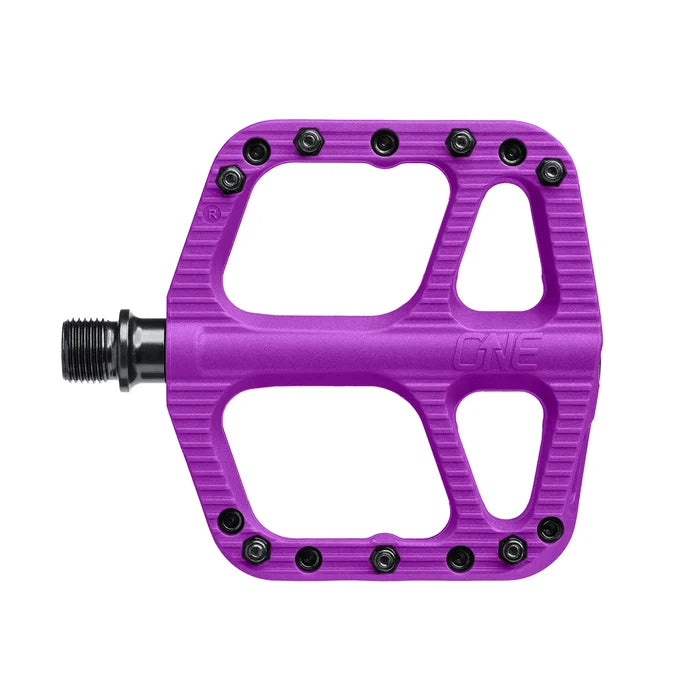 Purple bicycle pedal with 'One' branding on a white background