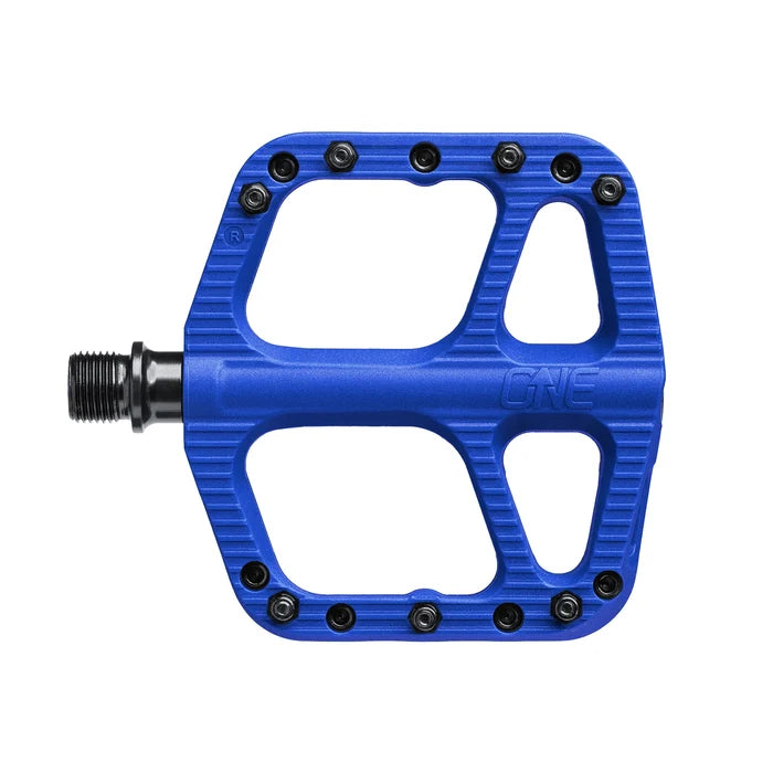 Blue bicycle pedal with 'One' branding on a white background