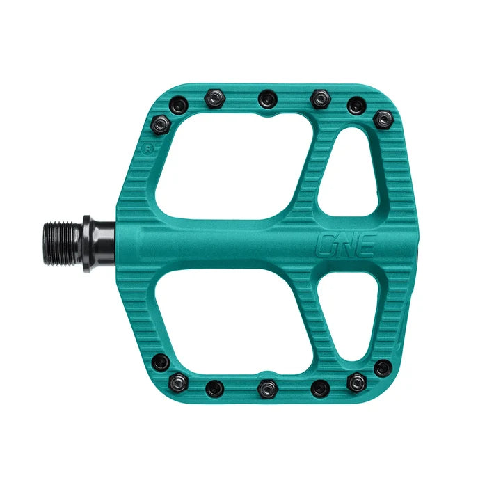 Teal bicycle pedal with 'ONE' branding on a white background