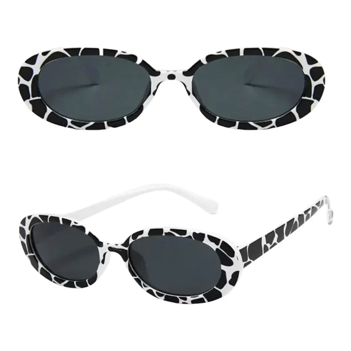 Women’s vintage-inspired oval sunglasses with black and white animal print and stylish summer look.