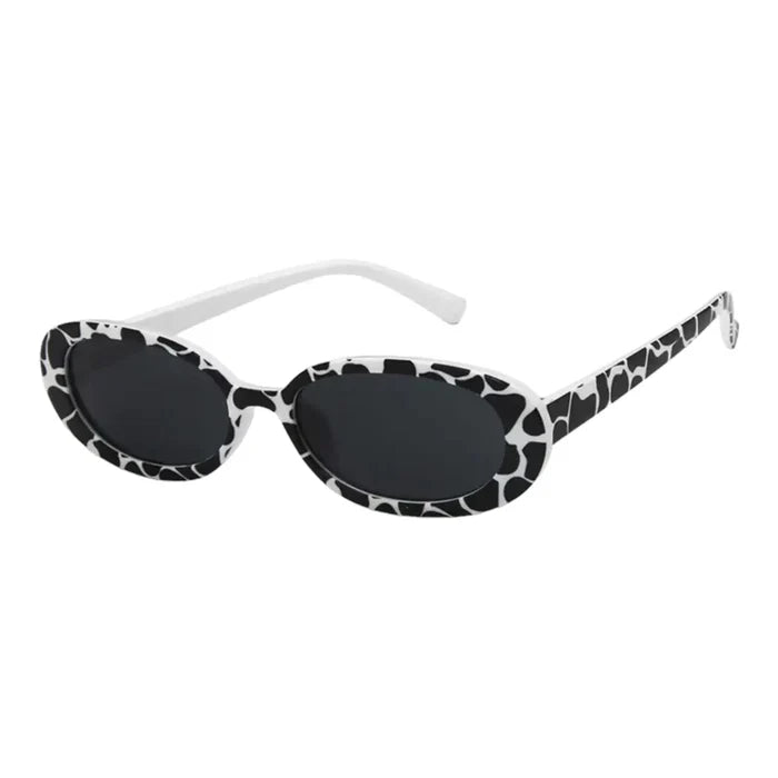 Women’s vintage-inspired oval sunglasses in a black and white and stylish summer look.