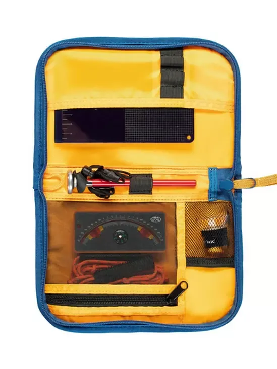 Yellow and blue tool pouch with various tools inside on a white background