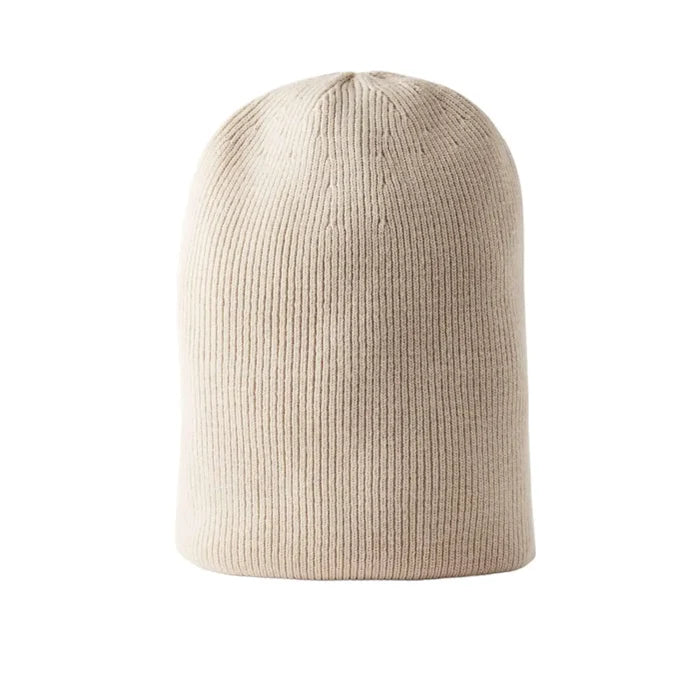 Solid color ribbed fisherman beanie skull cap in soft acrylic shown cuffed and slouchy styles beige flat lay