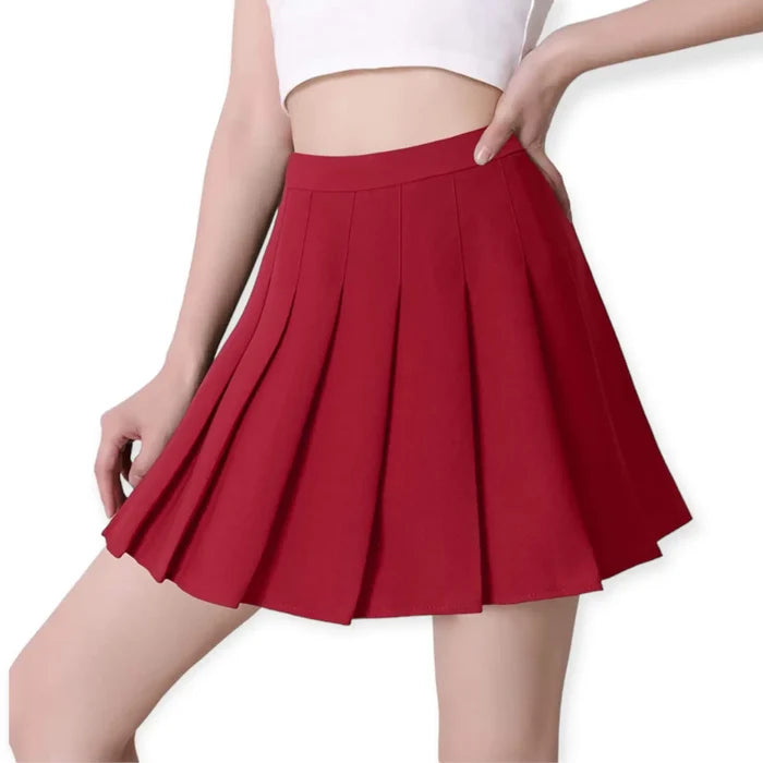 Solid pleated mini skirt in black with built-in shorts, high waist fit, and permanent pleats. Available in multiple colors. Y2K, schoolgirl, and punk-inspired.