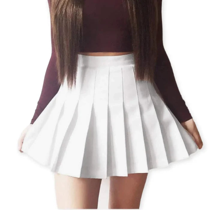 Solid pleated mini skirt in black with built-in shorts, high waist fit, and permanent pleats. Available in multiple colors. Y2K, schoolgirl, and punk-inspired.