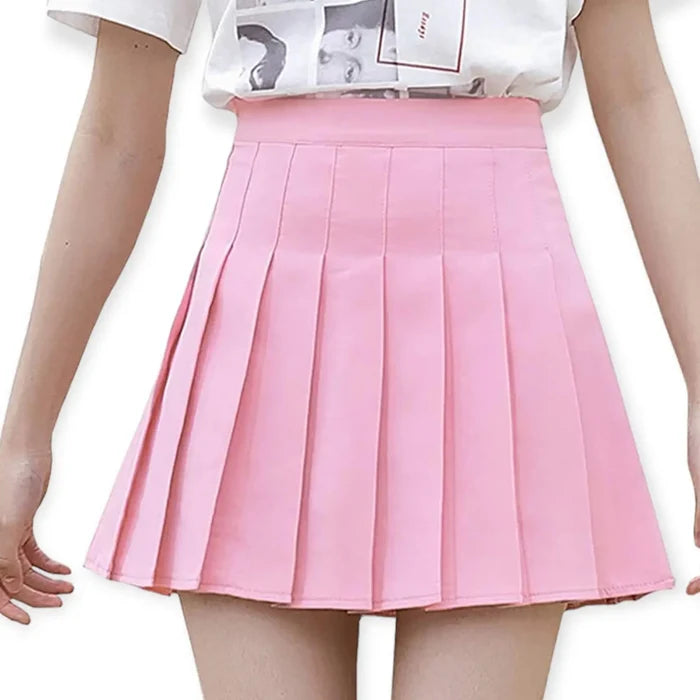 Solid pleated mini skirt in black with built-in shorts, high waist fit, and permanent pleats. Available in multiple colors. Y2K, schoolgirl, and punk-inspired.