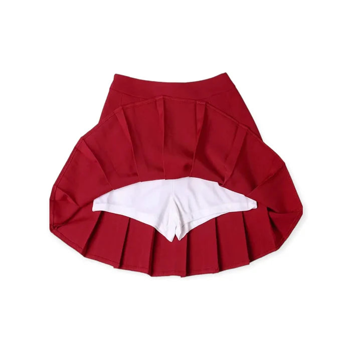Solid pleated mini skirt in black with built-in shorts, high waist fit, and permanent pleats. Available in multiple colors. Y2K, schoolgirl, and punk-inspired.