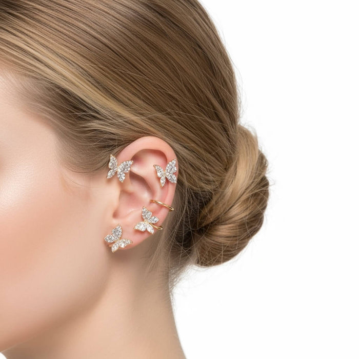 woman wearing gold left ear Sparkle Butterfly Ear Cuff Wrap Set Earrings with non-pierced cuffs and glittery wings gold /women's/osfm
