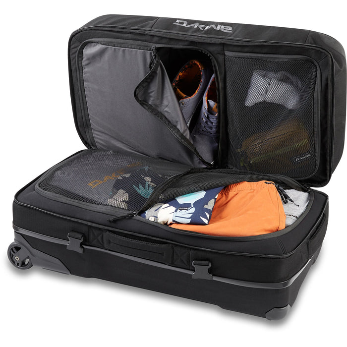 Black suitcase with open lid showing packed clothes on a white background