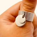 Stainless Steel Coin Charm Wide Band Ring in silver with rivet-textured band and two dangling coin charms worn 10.25