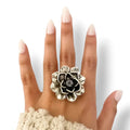 woman wearing Sterling Silver Antique Flower Statement Ring with 3D floral petals and dark center 9
