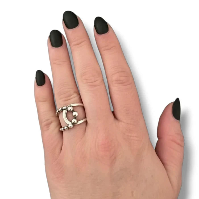 woman wearings Sterling Silver Beaded Open Wrap Ring women's adjustable cuff band and asymmetrical bead detail size 8
