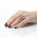 woman wearing on ring finger Sterling Silver Bite Me Snake Wrap Ring with antique silver textured serpent design