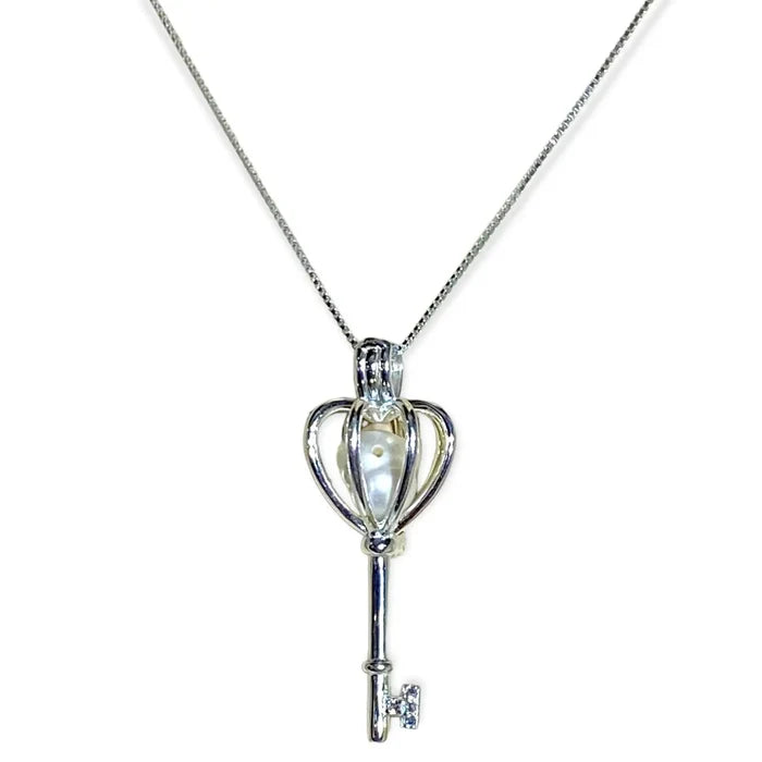 Sterling silver heart crown skeleton key pendant with faux pearl on dainty chain – necklace flat lay on neutral background