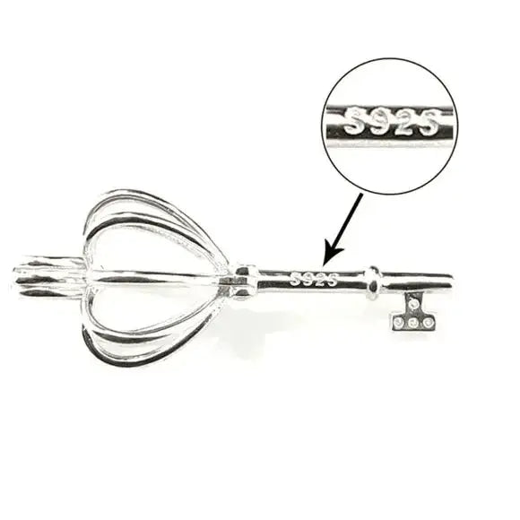 Sterling silver heart crown skeleton key pendant with faux pearl on dainty chain – necklace flat lay on neutral background