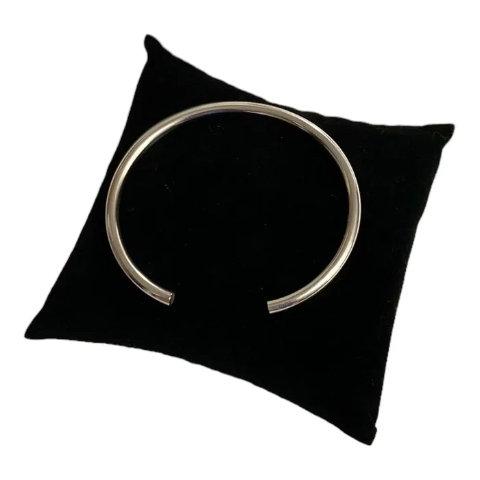 open cuff design Sterling Silver Smooth Open Bangle on black velvet pillow