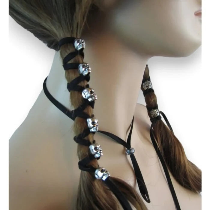 Silver Skulls braided in ponytails wrapped with suede skull hair tie