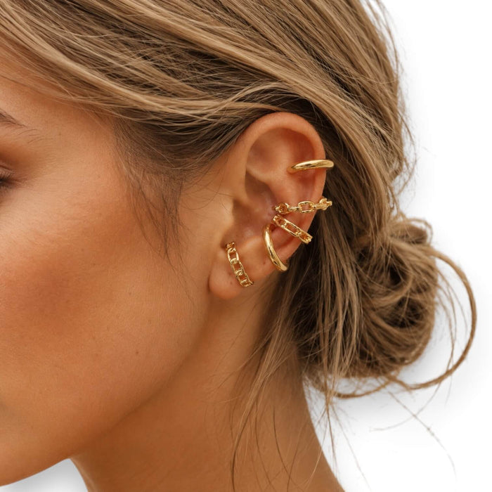 woman wearing Trendy Gold Stackable Ear Cuffs Set with 5 no-piercing cartilage cuffs in minimalist gold plated