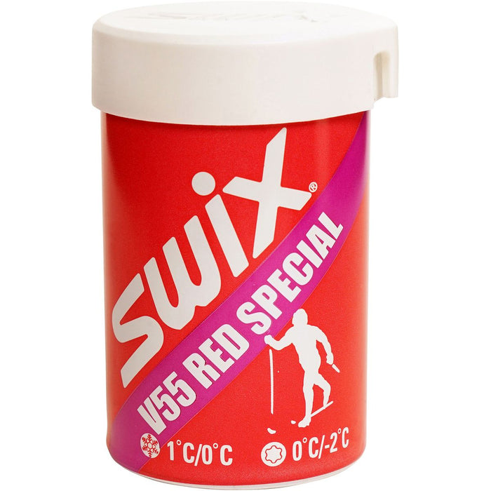 Red container of Swix V55 Red Special ski wax with white lid on a white background