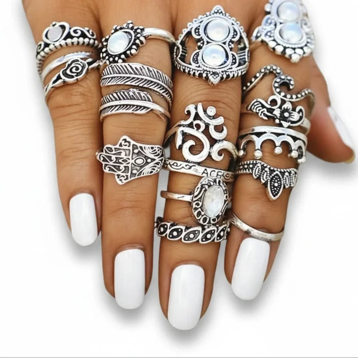 Vintage silver boho stacking rings set with 14 symbolic bands, blue faux stones and knuckle designs