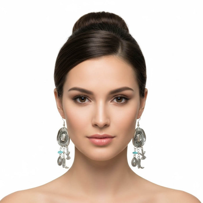 Woman wearing pair of Vintage Silver Cowboy Hat Charm Dangle Earrings with turquoise accents and boot charms women's / Osfm