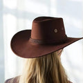 brown backside of wide brim chin strap Western cowboy hat for men or women