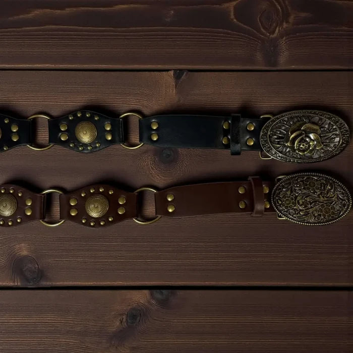 Western floral buckle medallion wide belt in brown or black vegan leather with antique gold studs rivets and O-rings, adjustable buckle closure, 1 3/8 inch strap width