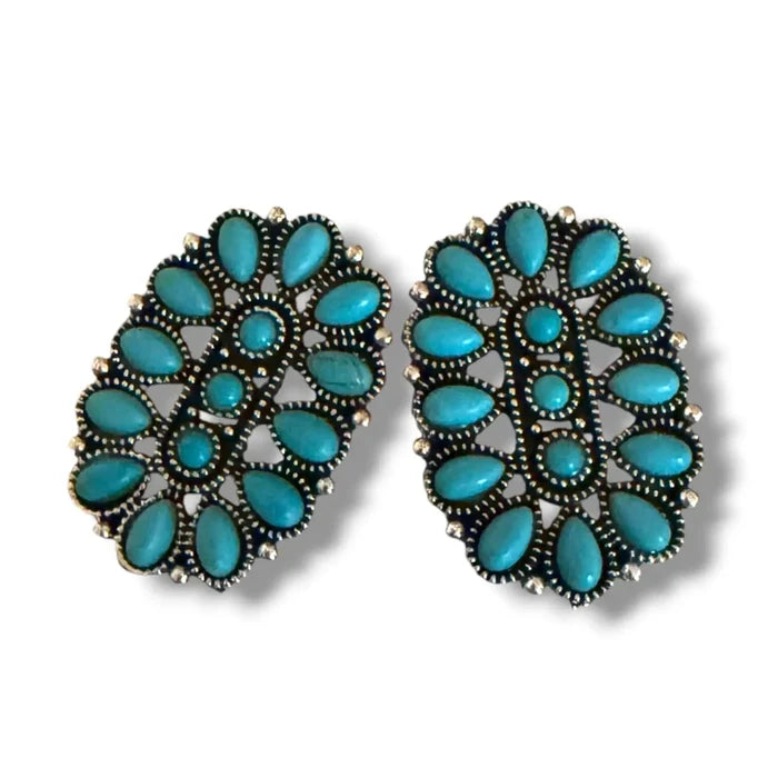 Western Turquoise Cluster Earrings showcasing bold faux cabochon stones in a silver-finish metal design.