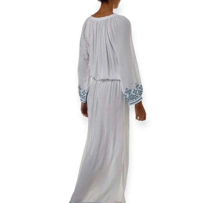 back side of White Blue Embroidered Kaftan Dress with lace-up tassel neckline, long sleeves, smocked waist, and side splits