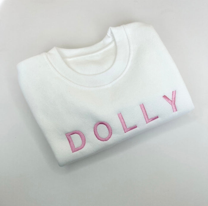 White jumper withPink Font
