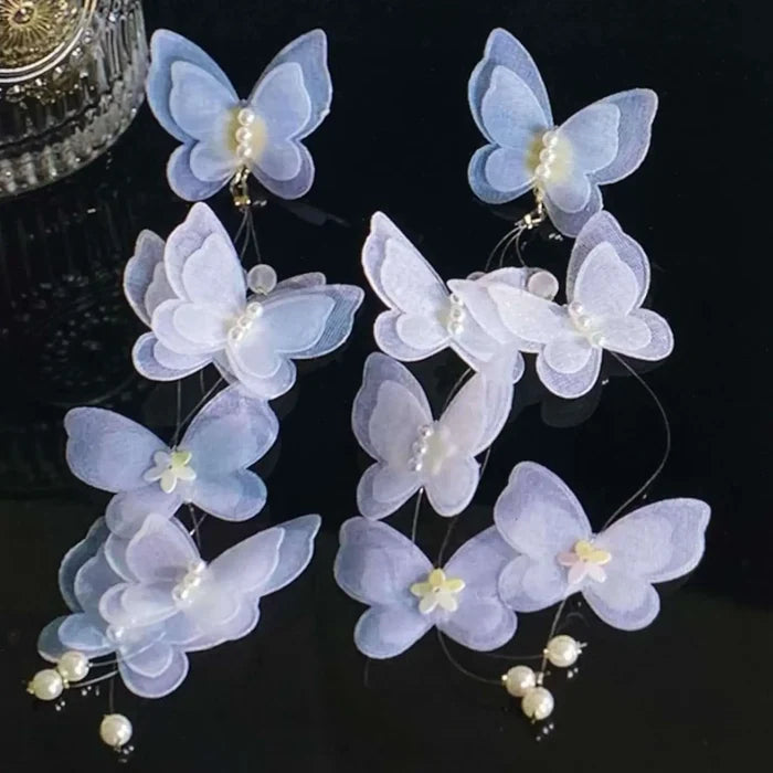 White Lace Butterfly Pearl Tassel Earrings with 3D lace wings, faux pearls, and long silver chain tassels