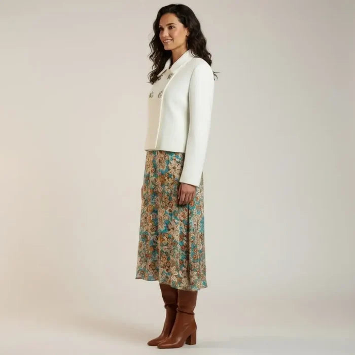 woman wearing side view with dress White Silver Cut Out Hardware Tweed Crop Blazer Jacket with ecru textured fabric, button closure, and front pockets